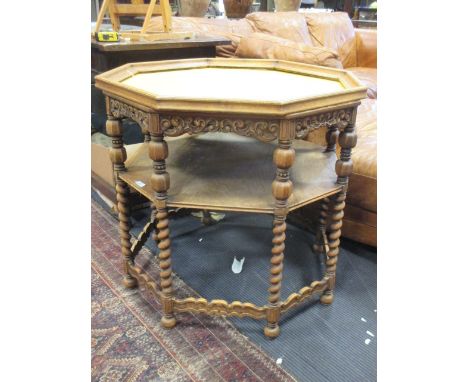 An octagonal centre table with carved freize, shelf and barley twist legs, a/f, 72 x 75cm  