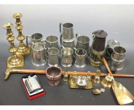 A collection of pewter mugs, brass candlesticks, other metal ware, a walking stick and a coaching horn  