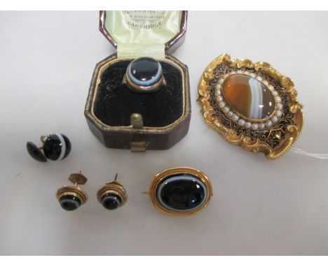 A 19th century banded agate, pearl and black enamel brooch, 5.2cm long, (tests as 14ct-18ct gold, 23g), together with a black