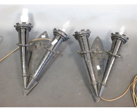 An iron wheel ceiling light, approx. 75cm wide, together with a pair of torch wall lights  
