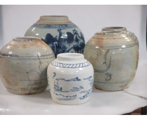A collection of Oriental blue and white ginger jars, some used as lamp bases  