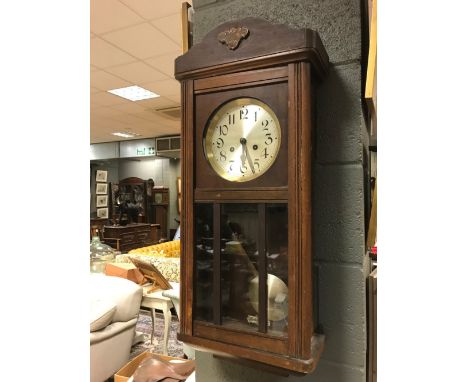 A 1930s oak case wall clock 78cm  