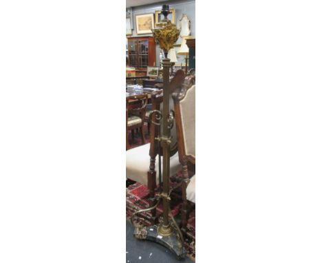 A gilt brass and lamp standard on a marble triform base 162cm high  