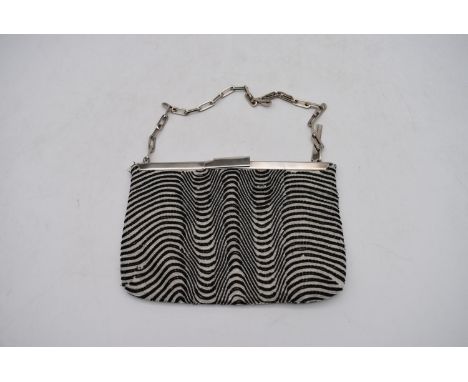 A vintage Gucci ladies evening bag, with black and white beaded design, H.15 W.22cm, with some wear and some losses to beadin