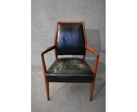 A mid 20th century vintage Danish teak framed armchair in leather upholstery. H.98x60cm 