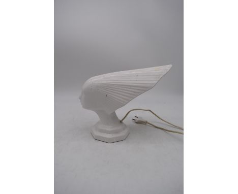 A vintage style white ceramic lamp in the form of the Spirit of the Wind. H.24x30cm 