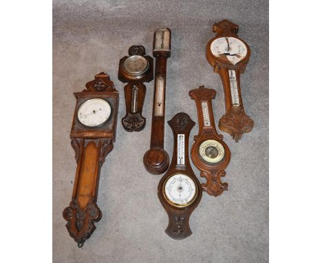 An early 19th century rosewood cased stick barometer and a miscellaneous collection of five late 19th century banjo barometer