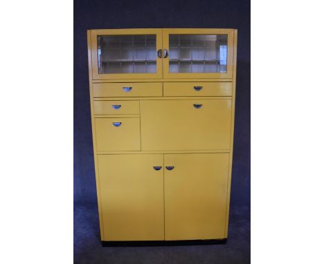 A large 1960's vintage kitchen cabinet with an arrangement of nine cupboards fitted with metal handles. H.178 x 110 x 41cm 