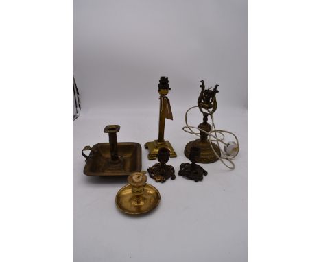 Two vintage brass lamp bases and various other brass candlesticks. H.28cm 