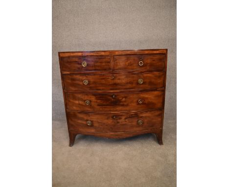 A Georgian mahogany and satinwood inlaid bowfronted chest of drawers on swept bracket feet. H.104x105x50cm 
