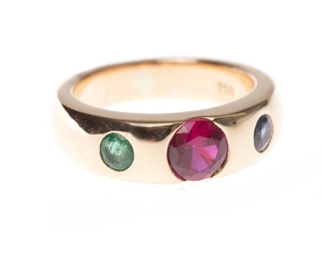 EIGHTEEN CARAT GOLD GEM SET BANDthe tapered band with a central created ruby flanked by an emerald and sapphire, size N, 11.9