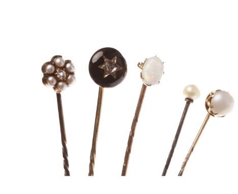 FIVE VARIOUS STICK PINScomprising a Victorian opal stick pin, unmarked, in a box; a pearl set pin marked 15, in a box and ano