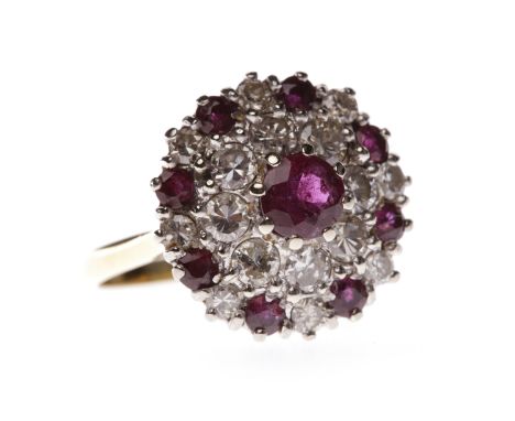 IMPRESSIVE RUBY AND DIAMOND CLUSTER RINGthe bezel of circular form and set with a central round ruby 5.5m diameter surrounded