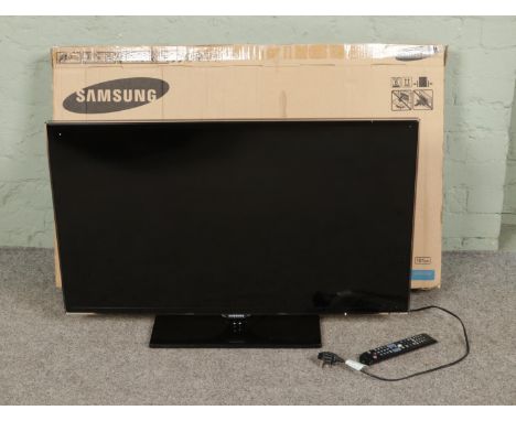 A Samsung 40 inch slim LED tv, in box with remote and power cable.