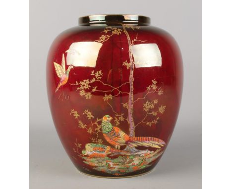 A large Crown Devon Fieldings rouge lustre ware vase decorated with pheasants. Height 21cm.