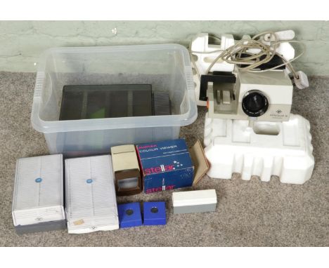 A vintage boxed Agfacolor 50 slide projector with slide viewers and cases.