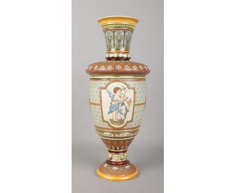 A Mettlach, Villeroy and Boch stoneware pedestal vase, pattern 1537. Featuring floral decoration and two raised panels depict