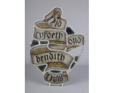 An ecclesiastical salvage stained glass panel with hand painted calligraphy design 'Gid forth ond bendith Duw' Go Forth With 