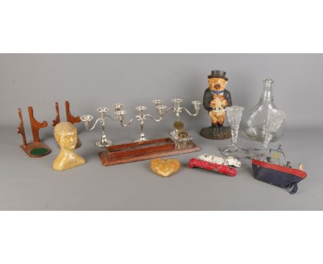 A box of assorted items, to include desk tray, cast iron door stop, model boat, epergne and three three-branch candelabra etc
