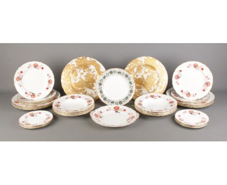A quantity of Royal Crown Derby ceramics, mainly in the Bali pattern. To also include two large dinner plates in the 'Gold Av