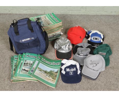 A box of 1970s Motor Sport magazines along with a collection of Motor Racing baseball caps and a Williams Formula One team ba