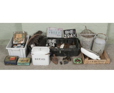 Three boxes metalware, including vintage cast iron embossing press, tin boxes, water can, cast iron bucket with toolheads, ba