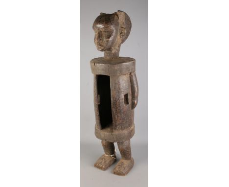 A ceremonial West African tribal Dan slit drum of vertical figural form. Approx. standing height 73cm.  No drum stick present