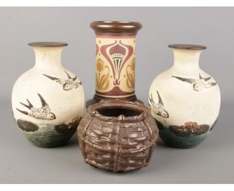 Four Bretby pottery vases. Includes a pair of vases decorated with swifts, basket squat vase and Art Nouveau style cylindrica
