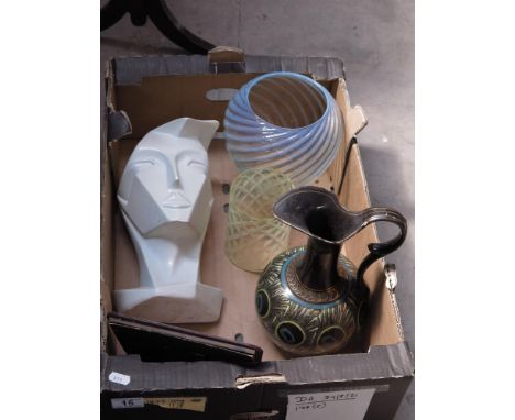 A Doulton Lambeth jug, hand painted with peacock feathers, a modernist sculpture of a man's head, and two opalescent glass li