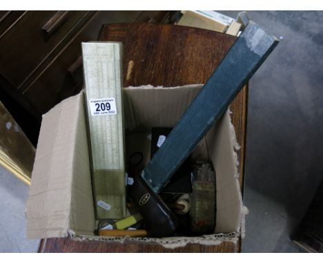 A collection of various office drawing tools including slide rule, magnet, sealing wax, blotter, etc