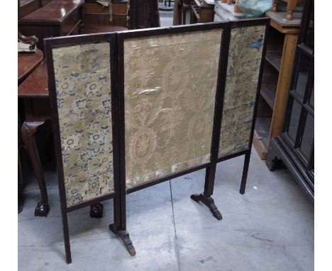 A Regency mahogany triptych firescreen, with silk embroidered panels, 100 by 55cm (closed). 