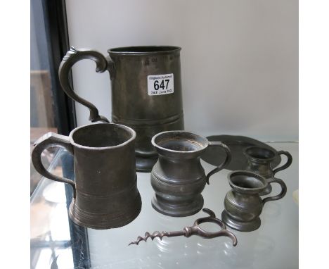 A Collection of 19th century pewter ware, including quart tankard, measures, etc and a corkscrew  (7)