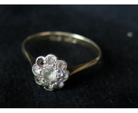 A 9ct gold and white stone cluster ring