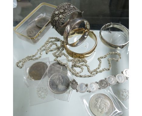 A Collection of jewllery and coins including a 1/5 9ct gold metal core hinged bangle, two silver bangles, a white metal India
