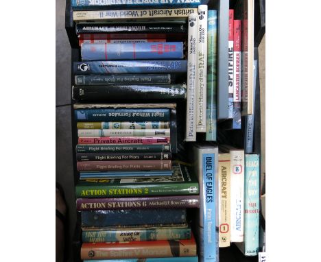 A collection of aviation books, including The Hurricane II manual, Paul BRickhill Reach for the Sky, and other biographical a