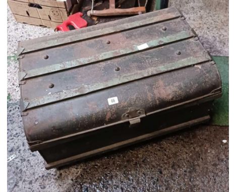 A METAL TRAVEL TRUNK