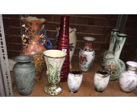 SHELF OF VARIOUS VASES OF VARIOUS STYLES