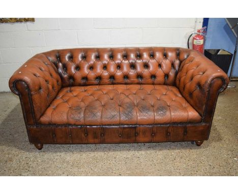 Brown leather Chesterfield sofa