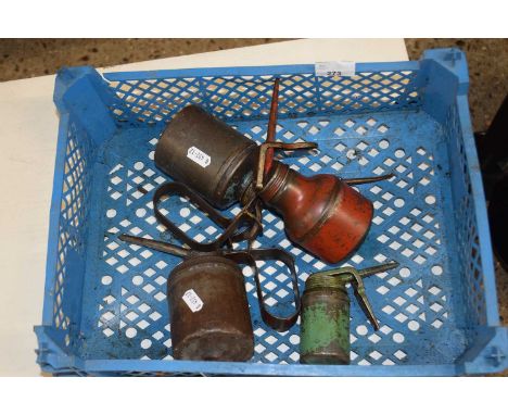 A group of four vintage oil cans
