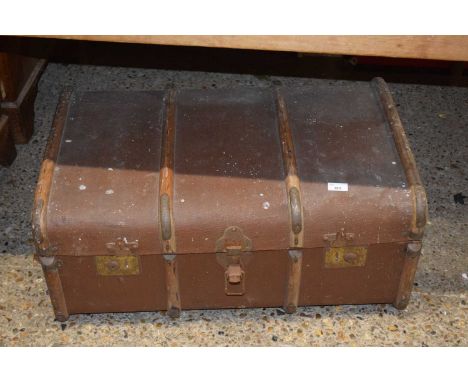 A vintage wooden bound suitcase