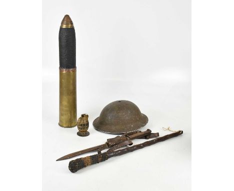 A WWII army helmet, a deactivated granade, a large artillery shell, length 56cm, a bayonet and a large cosh (5).