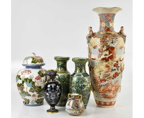 A late 19th century Continental pâte-sur-pâte twin handled vase, decorated with mask heads and fruit in the classical style, 