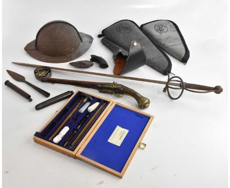 An Eastern percussion cap pistol, with brass applied mounts, assorted gun cases, a reproduction cast metal Civil War style he