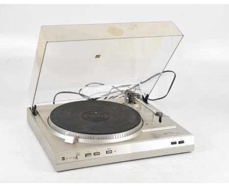 DUAL; a CS 617Q turntable, with manual and associated box.Condition Report: The turn table spins freely however we do not gua