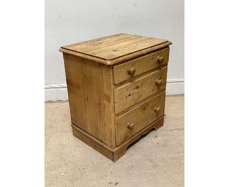 An old pine chest of three drawers, on bracket feet, height 84cm, width 74cm.