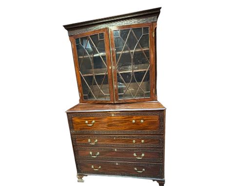 A 19th century Chinese mahogany secretaire bookcase, the upper section with moulded cornice above two glazed doors, the base 