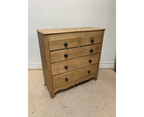 An old pine chest of two short over three long drawers, on bracket feet, width 125cm, depth 53cm, height 130cm.