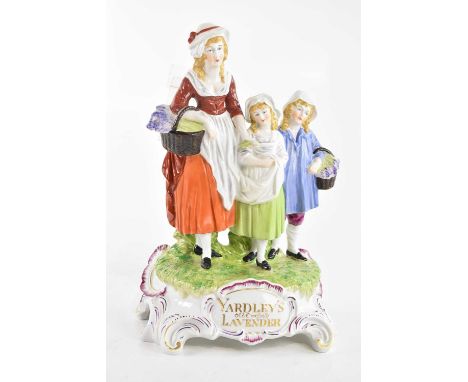 DRESDEN; an advertising figure group, 'Yardley's Old English Lavender', height 31cm (af).Condition Report: Old repair and los