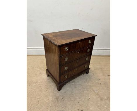 A 19th century mahogany commode chest, on bracket feet, height 77cm, width 67cm, depth 44cm.