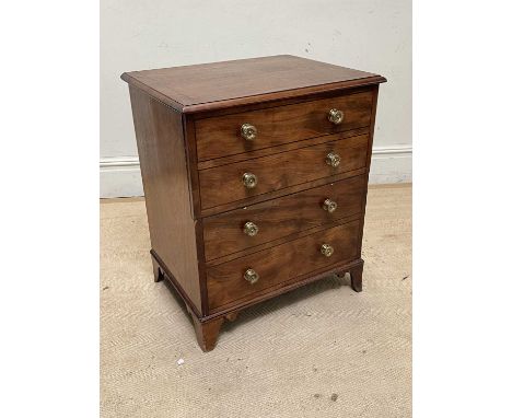 A 19th century commode chest, on bracket feet, height 76cm, width 63cm, depth 50cm.